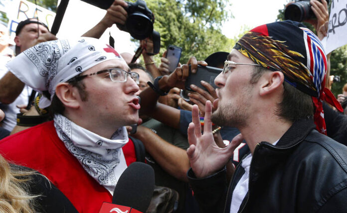 A counterprotester, left, confronts a supporter of President Donald Trump in 2017 at a 