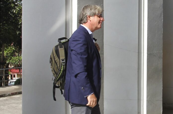 British BBC correspondent Jonathan Head on Wednesday enters the provincial court at the start of his trial. Photo: Associated Press
