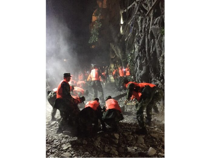 Rescuers work at a tourist site in Zhangzha in Jiuzhaigou county Wednesday in southwestern China's Sichuan province. Photo: Zheng Lei / Associated Press