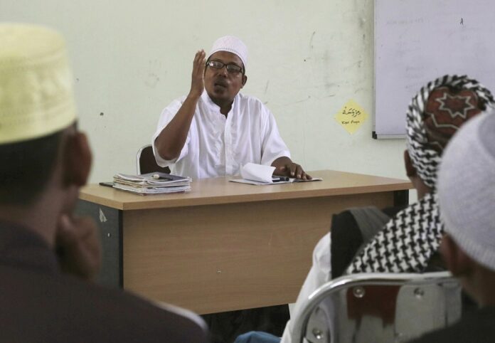Former radical preacher Khairul Ghazali teaches at Al Hidayah Islamic Boarding School, a school set up for the sons of Islamic militants in 2017 in Sei Mencirim, North Sumatra, Indonesia. Photo: Binsar Bakkara / Associated Press