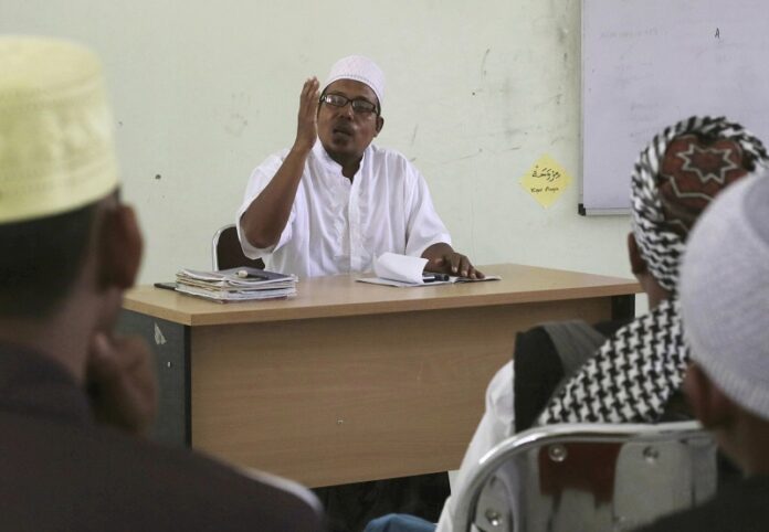 Former radical preacher Khairul Ghazali teaches at Al Hidayah Islamic Boarding School, a school set up for the sons of Islamic militants in 2017 in Sei Mencirim, North Sumatra, Indonesia. Photo: Binsar Bakkara / Associated Press Former radical preacher Khairul Ghazali teaches at Al Hidayah Islamic Boarding School, a school set up for the sons of Islamic militants in 2017 in Sei Mencirim, North Sumatra, Indonesia. Photo: Binsar Bakkara / Associated Press