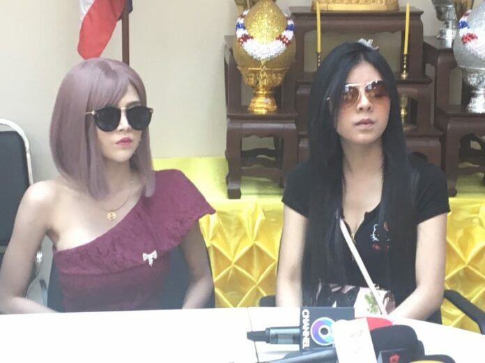Thanyakarn ‘Meya’ Rojin, left and Kanchanaicha ‘Kik’ Buranon, right, Thursday at the Bang Khen Police Station in Bangkok.