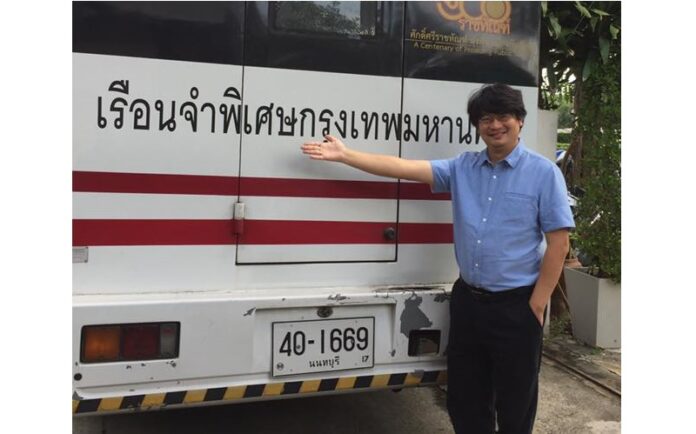 Activist Sombat Boonngamanong poses Wednesday with a Bangkok Remand Prison vehicle. Photo: Sombat Boonngamanong / Facebook