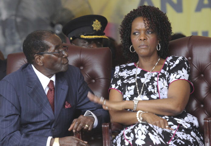Zimbabwe President Robert Mugabe, left, and his wife Grace attend his birthday celebrations in 2016 in Masvingo, Zimbabwe. Photo: Tsvangirayi Mukwazhi / Associated Press