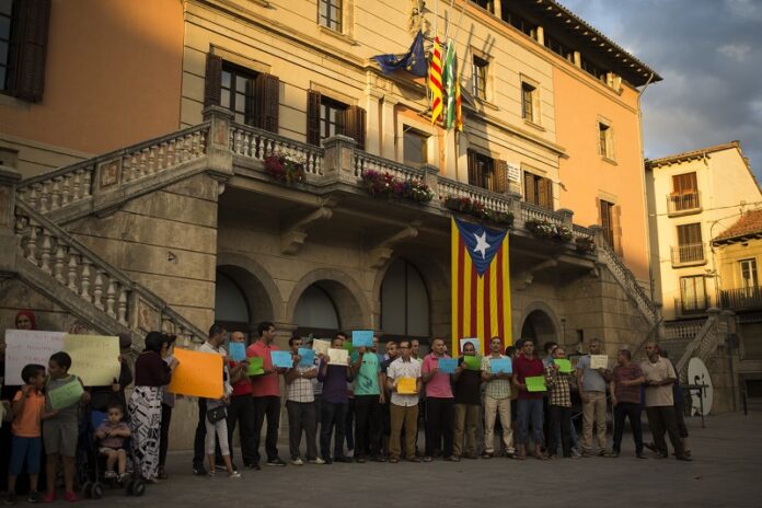 Members of the local Muslim community gather along with relatives of young men believed responsible for the attacks in Barcelona and Cambrils to denounce terrorism and show their grief Sunday in Ripoll, north of Barcelona, Spain. Photo: Francisco Seco / Associated Press