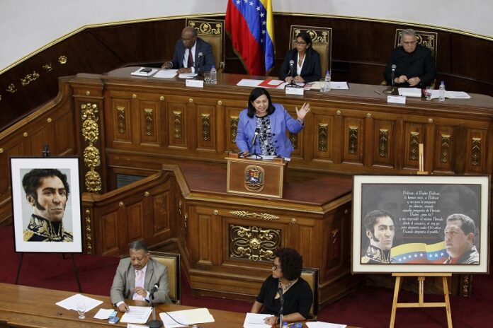 Constitutional Assembly delegate Carmen Melendez speaks from the podium Tuesday during a session in Caracas, Venezuela. Photo: Ariana Cubillos / Associated Press