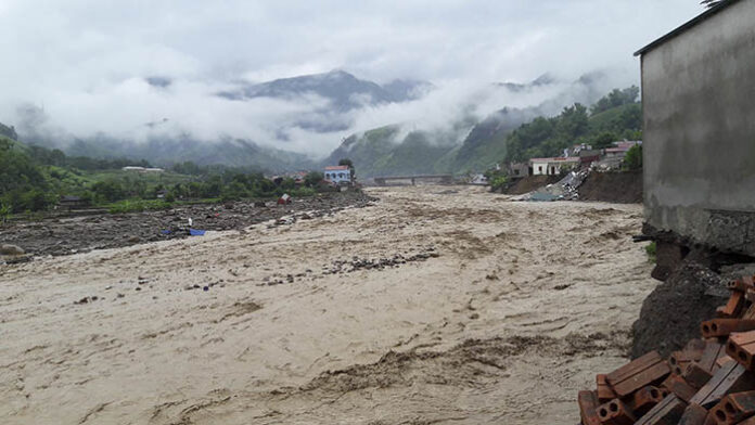 A flooded river rages Thursday in the northern province of Son La, Vietnam. Photo: Vietnam News Agency / Associated Press