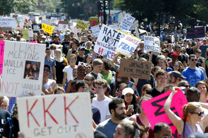 Counterprotesters stand on the periphery of a 'Free Speech' rally staged by white nationalists and white supremacists Saturday on Boston Common in Boston. Photo: Michael Dwyer / Associated Press