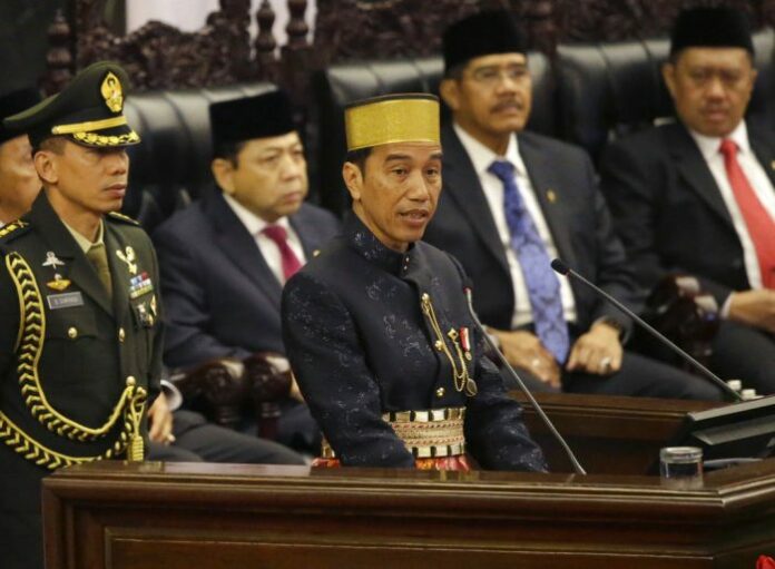 Indonesia's President Joko Widodo, at center, delivers his State of The Nation address in 2017 ahead of the country's Independence Day at the parliament building in Jakarta. Photo: Tatan Syuflana / Associated Press