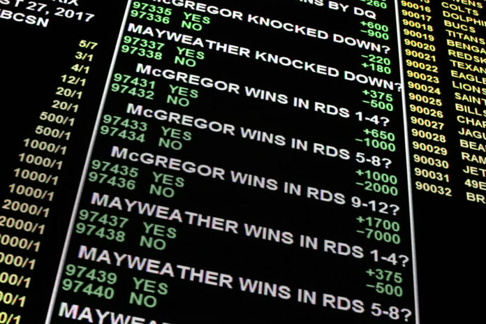 A board displays odds for different bets for the fight between Floyd Mayweather Jr. and Conor McGregor at the Westgate Superbook sports book, Thursday in Las Vegas. Photo: John Locher / Associated Press