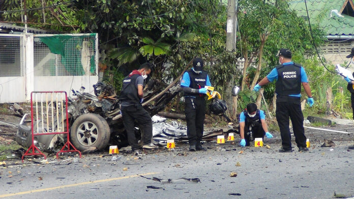 Officials inspect the scene where a truck exploded Thursday morning outside the Mayo Police Station in Pattani province. Read: Hostage Dies, Stolen Truck Explodes at Police Station