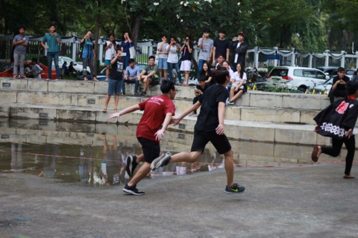 Students engage in a 'Naruto Run' on Thursday at Thammasat University. Image: MrPounds Wss / Facebook