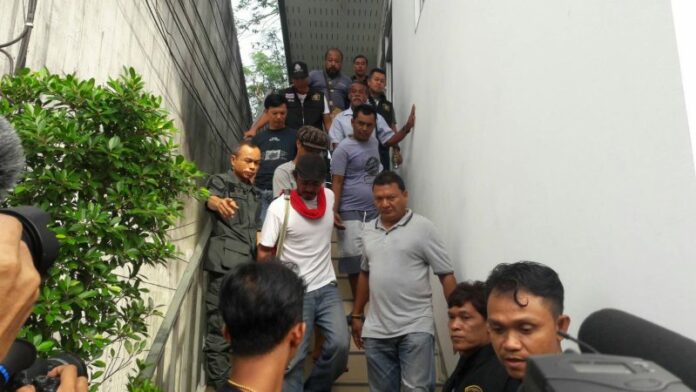 Five suspects in the rape case of a 14-year-old are led out of Khokkhoi Police Station Saturday.