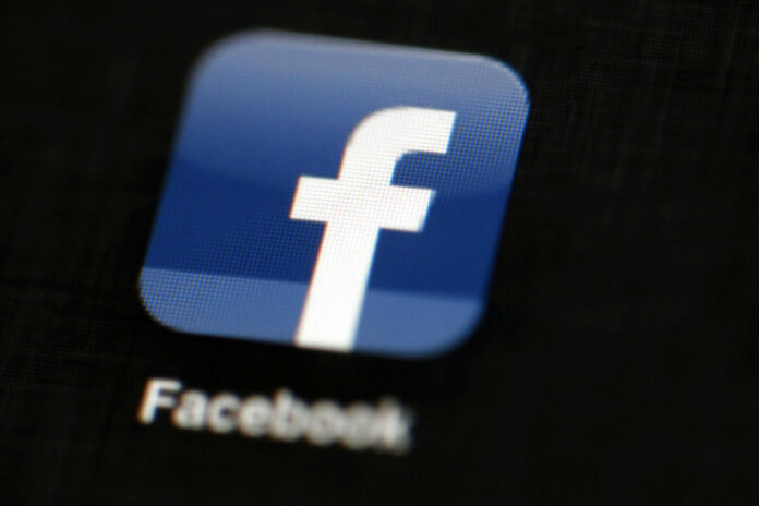 Facebook's logo displayed on an iPad in a 2012 file photo. Photo: Matt Rourke / Associated Press
