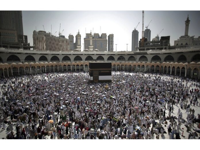 Muslim pilgrims circumambulate around the Kaaba, the cubic building at the Grand Mosque, ahead of the annual Hajj pilgrimage Monday in the Muslim holy city of Mecca, Saudi Arabia. Photo: Khalil Hamra / Associated Press