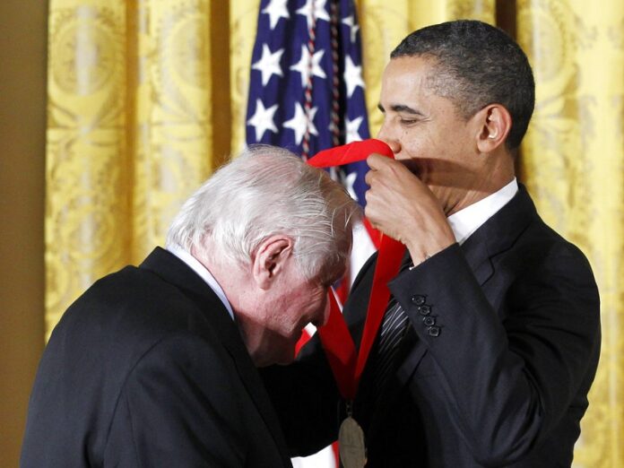 President Barack Obama presents a 2011 National Humanities Medal to poet John Ashbery in 2012 in the East Room of the White House in Washington. Photo: Pablo Martinez Monsivais / Associated Press