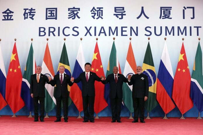 From left, Brazil's President Michel Temer, Russian President Vladimir Putin, Chinese President Xi Jinping, South Africa's President Jacob Zuma and Indian Prime Minister Narendra Modi pose for a group photo during the BRICS Summit at the Xiamen International Conference and Exhibition Center on Monday in Xiamen, southeastern China's Fujian Province. Photo: Wu Hong / Associated Press