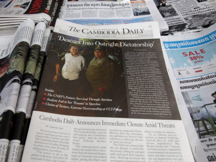 The final issue of The Cambodia Daily is sold Monday at a newsstand, in Phnom Penh, Cambodia. Photo: Heng Sinith / Associated Press