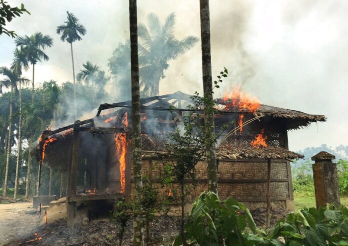 Houses are on fire Thursday in Gawdu Zara village, northern Rakhine state, Myanmar. Photo: Associated Press