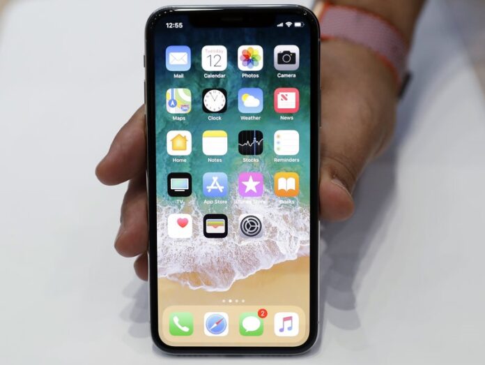 The iPhone X is displayed in the showroom after the new product announcement at the Steve Jobs Theater on the new Apple campus Tuesday in Cupertino, California. Photo: Marcio Jose Sanchez / Associated Press