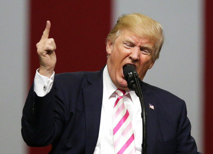 US President Donald Trump speaks in 2017 at a campaign rally in support of Sen. Luther Strange, in Huntsville, Alabama. Photo: Brynn Anderson / Associated Press