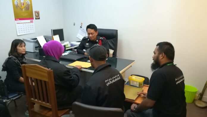 The 14-year-old alleged victim talks to police Sunday at the Khokkloi police station in Phang Nga province.