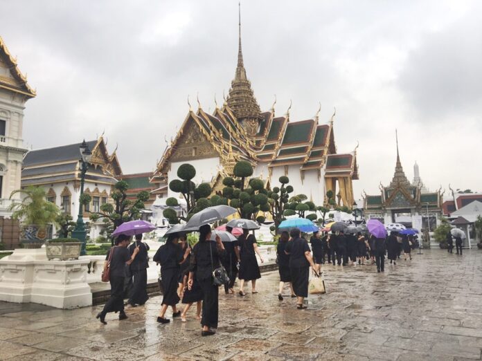 Mourners make their way inside the Grand Palace on Jan. 10 to pay their respects to His Majesty the Late King Bhumibol in Bangkok.