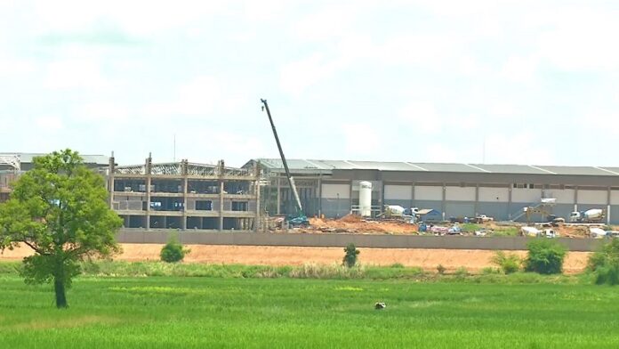 The disputed area where a Red Bull plant can be seen under construction Monday in Khon Kaen province.