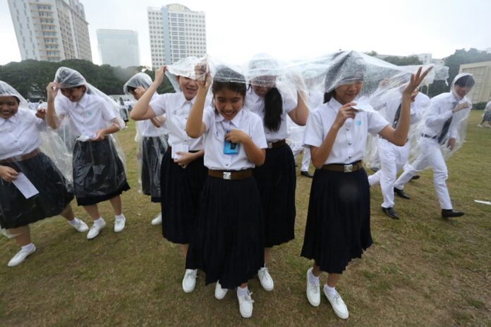 Incoming Chulalongkorn University freshmen participate in an Aug. 3 initiation ceremony.