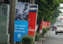 Democrat Party Predicts Loss of 2 Million Members Campaign posters on a Bangkok street in the run-up to the 2011 general election.