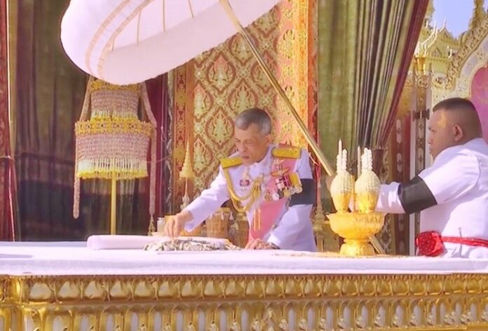 King Maha Vajiralongkorn, or Rama X, participated in a religious ceremony Friday to collect the ashes and relics of his father, King Bhumibol, or Rama IX.