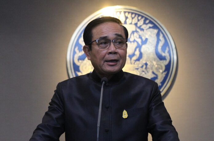 Junta chairman Prayuth Chan-ocha speaks to reporters in September 2017 at Government House.