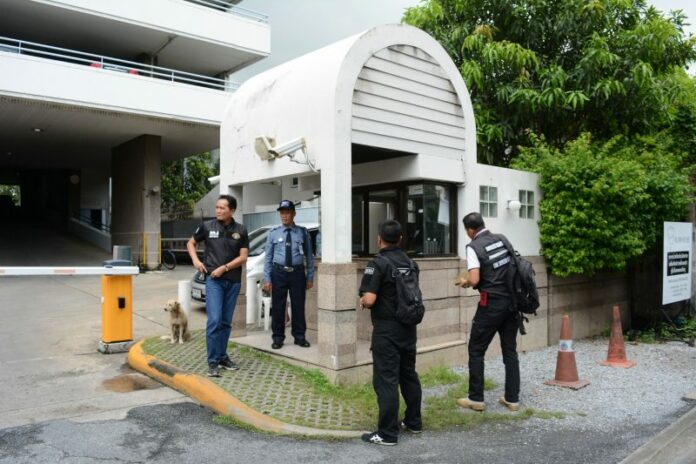 Police investigate the CCTV tapes Wednesday at Ratchada Pavilion.