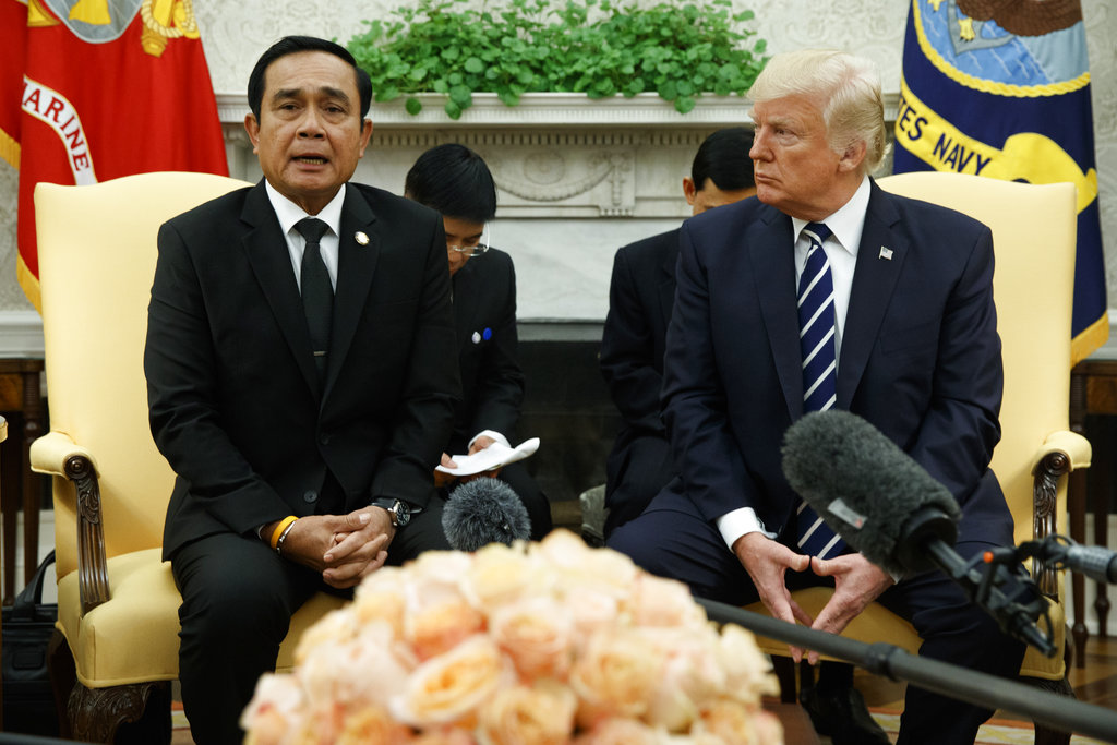 President Donald Trump listens as Thai Prime Minister Prayuth Chan-ocha speaks during a Monday meeting in the Oval Office of the White House in Washington. Photo: Evan Vucci / Associated Press