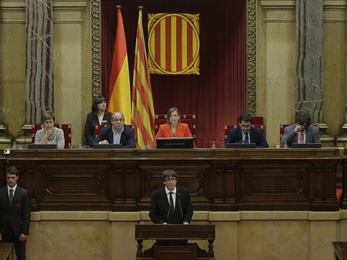 Catalan regional President Carles Puigdemont delivers his opening speech Tuesday at the parliament in Barcelona, Spain. Photo: Manu Fernandez / Associated Press