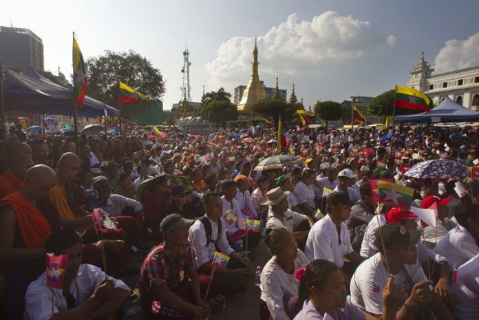 Participants attend a ceremony supporting the country's military and government servants Sunday in Yangon, Myanmar. Photo: Thein Zaw / Associated Press