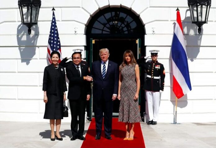 Prime Minister Prayuth Chan-ocha stands by his counterpart US President Donald Trump and their respective spouses, Monday in Washington. Photo: Associated Press