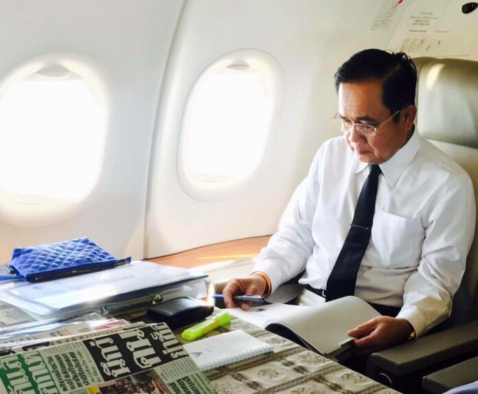 A picture of Prime Minister Prayuth Chan-ocha studying on the plane taking him to China to join the BRICS summit was posted on the page Gen. Prayuth Chan-ocha and Team on Sept. 4.