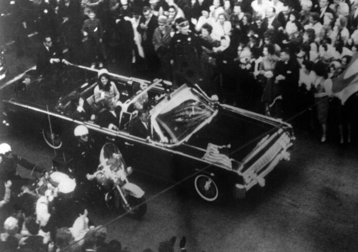 An overhead view of President John F. Kennedy's car in Dallas motorcade on Nov. 22, 1963, image provided by the Warren Commission as Exhibit No. 698. Special agent Clinton J. Hill is shown riding atop the rear of the limousine. Photo: Warren Commission