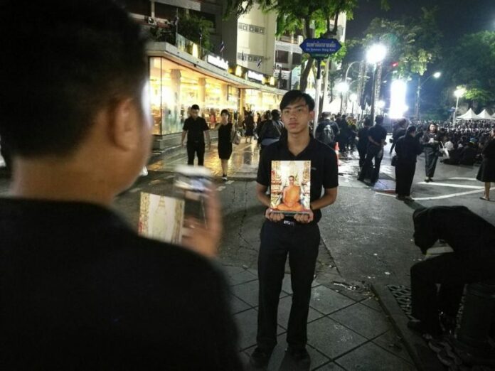 Mourners Thursday night near the Democracy Monument in Bangkok.