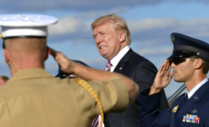 President Donald Trump walks down the steps of Air Force One on Friday at Morristown Municipal Airport in Morristown, New Jersey. He spent the weekend at his New Jersey golf club. Photo: Susan Walsh / Associated Press