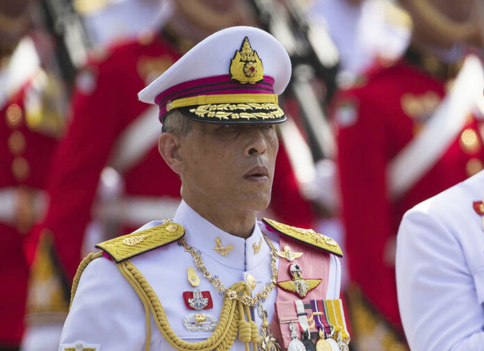 King Vajiralongkorn walks Thursday, Oct. 26, 2017, during a procession for his father. Photo: Wason Wanichakorn / Associated Press