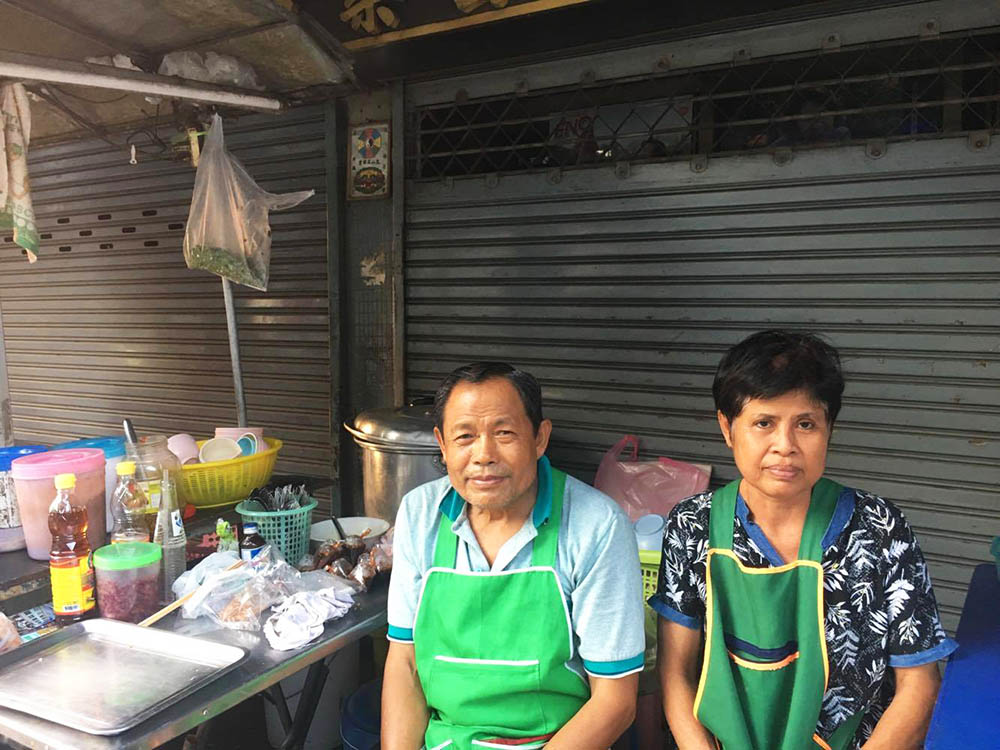 Pa Thongbai and her husband Loong Buntham operate a noodle stall in Bangkok's Bang Rak district.