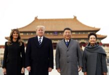 Trump Starts Leaving Postal Union in Latest Anti-China Move U.S. President Donald Trump, second left, first lady Melania Trump, left, Chinese President Xi Jinping and his wife Peng Liyuan stand together as they tour the Forbidden City in 2017 in Beijing, China. Photo: Andrew Harnik / Associated Press