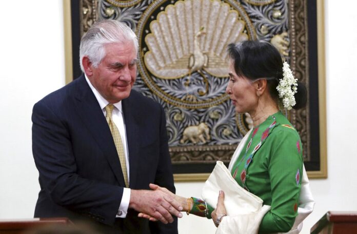 Myanmar's leader Aung San Suu Kyi, right, shakes hands with visiting U.S. Secretary of State Rex Tillerson after their press conference at the Foreign Ministry office Nov. 15 in Naypyitaw, Myanmar. Photo: Aung Shine Oo / Associated Press