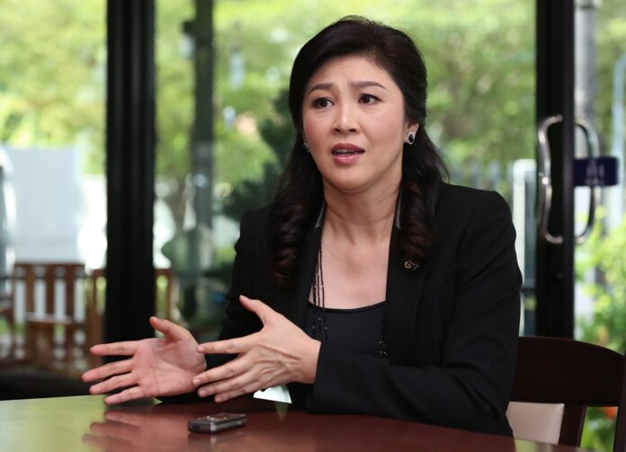 Former prime minister Yingluck Shinawatra talks to a reporter on Jan. 3, 2017.