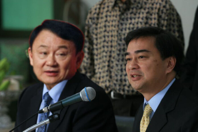 A completely fake image of Democrat Party leader Abhisit Vejjajiva, at right, with de facto Pheu Thai leader, fugitive former Prime Minister Thaksin Shinawatra.