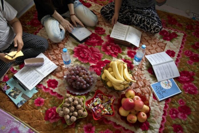 In this Sept. 8, 2017, photo, North Korean women gather for a prayer meeting at a home near the city of Chaoyang in northeastern China's Liaoning province. Photo: Ng Han Guan / Associated Press