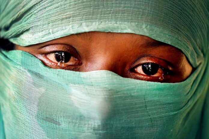 In this Wednesday, Nov. 22, 2017, photo, F, 22, who says she was raped by members of Myanmar's armed forces in June and again in September, cries as she speaks to The Associated Press in her tent in Kutupalong refugee camp in Bangladesh. The Associated Press has found that the rape of Rohingya women by Myanmar's security forces has been sweeping and methodical. The AP interviewed 29 women and girls who say they were raped by Myanmar's armed forces, and found distinct patterns in their accounts, their assailants' uniforms and the details of the rapes themselves. The most common attack involved groups of soldiers storming into a house, beating any children inside and then beating and gang raping the women. Photo: Wong Maye-E / Associated Press