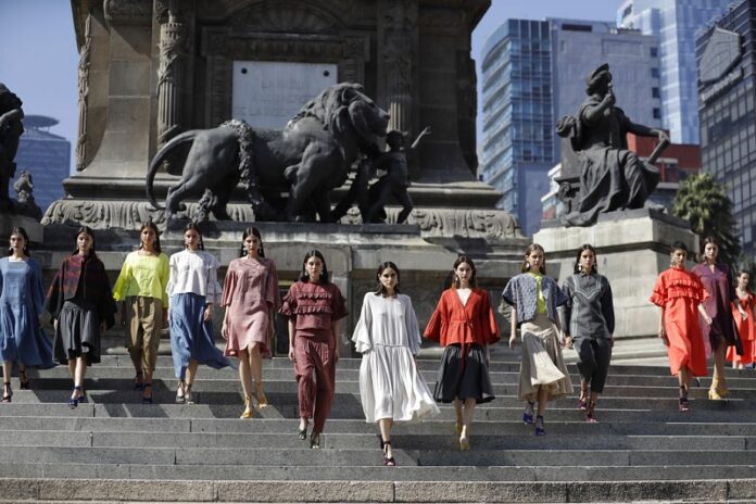 Models displays creations by Mexican fashion house Yakampot during a fashion show at the Angel of Independence monument, in November in Mexico City. Mexico City has been designated a World Design Capital for 2018 by the International Council of Societies of Industrial Design. Photo: Rebecca Blackwell / Associated Press
